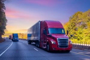 Semi trucks drive down a highway in New York. There is no average settlement amount for a semi-truck accident because every case is different. Consult a truck crash attorney to find out how much you can recover for your injuries and losses.