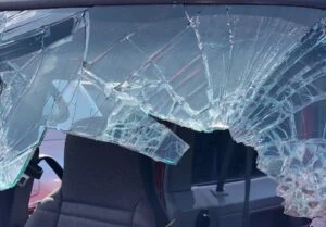 Car windshield shattered after an accident that could use the help of an attorney