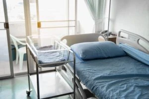 Modern and comfortable equipped hospital room with bed for newborn