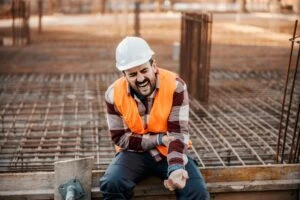 A construction worker in pain after accident