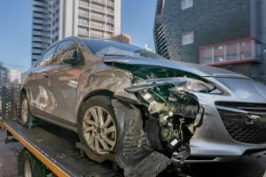 A Lyft car unit transported by tow truck after accident