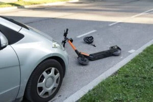 Scooter Accident with a car on a street