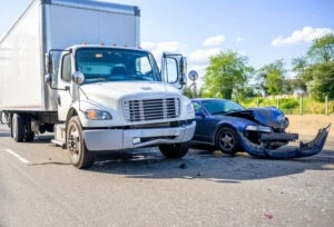 A truck has been involved in an accident with a smaller vehicle.