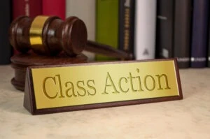 A nameplate belonging to a Westchester mass tort and consumer class action lawyer is near a gavel.