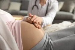 A pregnant woman at a doctor’s office needs a Westchester OBGYN malpractice lawyer.