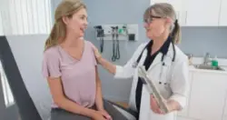 A woman speaks with her doctor about common types of obstetric or gynecology malpractice.