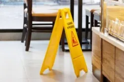 A wet floor sign is put away before someone needs a Las Vegas slip and fall lawyer.