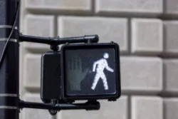 The photo shows a pedestrian crosswalk sign. Contact a Culver City pedestrian accident lawyer.