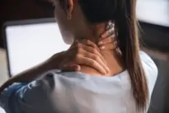 a girl with neck pain