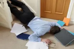 businessman falling down the stairs