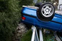 car rolled over onto a guardrail