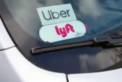 car with Uber and Lyft stickers