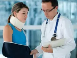 doctor checking woman’s cast