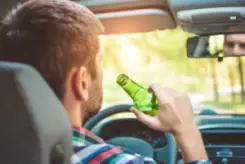 guy drinking while driving