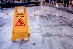 slippery floor with wet floor sign