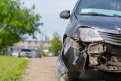 smashed front-end of a car after a speeding accident