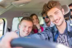teen driver with his friends in the car