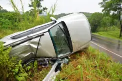 van overturned in a ditch