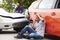 motorists on their phones after auto collision