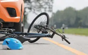 bicycle and helmet on ground