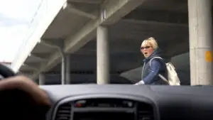 woman about to be hit by a car