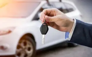 rental car agent holding key
