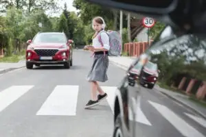 schoolgirl in crosswalk