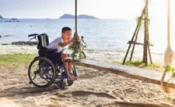 A child with cerebral palsy playing while in their wheelchair