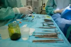 A medical table with supplies prepped for surgery