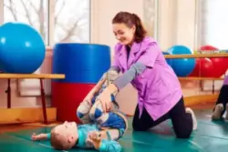 A child with Erbs palsy doing physical therapy