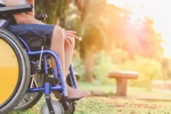 A person in a wheelchair in a park