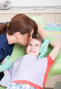 A child with cerebral palsy with a caretaker