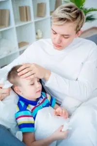 A child being taken care of by a caretaker
