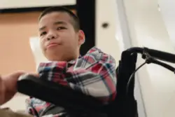A child with cerebral palsy in a wheelchair