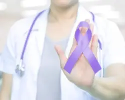 A nurse holding a ribbon for Cerebral Palsy Awareness