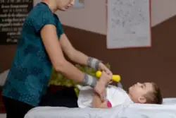 A child with cerebral palsy doing physical therapy