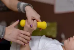 A child with cerebral palsy doing physical therapy exercises