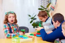 Four children with cerebral palsy playing
