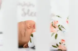 sleeping baby in flowered blanket