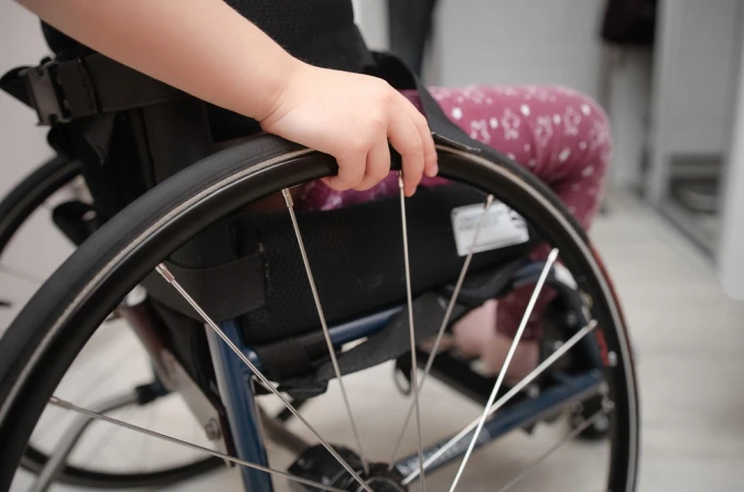 Child with cerebral palsy in a wheelchair.