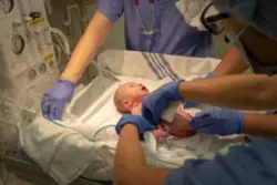 Newborn being attended to in hospital