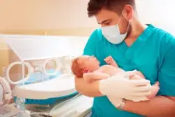 nurse cares for a baby