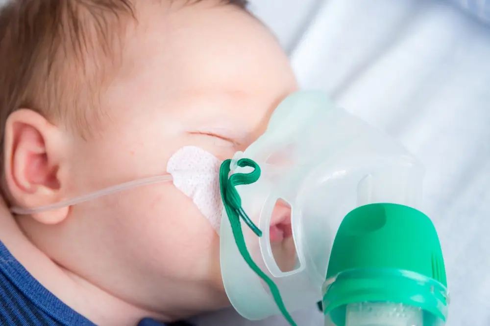 weak newborn receives oxygen and saline in hospital