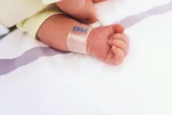newborn with hospital id wristband