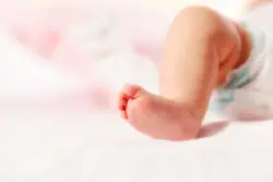 close-up of baby’s right leg and foot