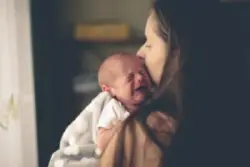 A newborn baby is crying. Call an Atlanta birth asphyxia lawyer for help.