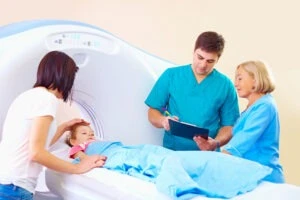 A girl prepares to get a CT scan to diagnose potential cerebral palsy. Scans like this can confirm brain damage.