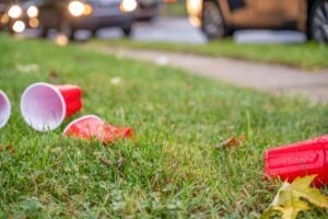 Red plastic cups lay strewn across the yard after a frat house’s pledge night. What are the key features of hazing laws?