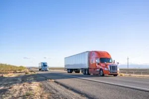 commercial trucks driving together