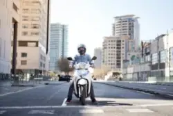 man on motorcycle wearing helmet